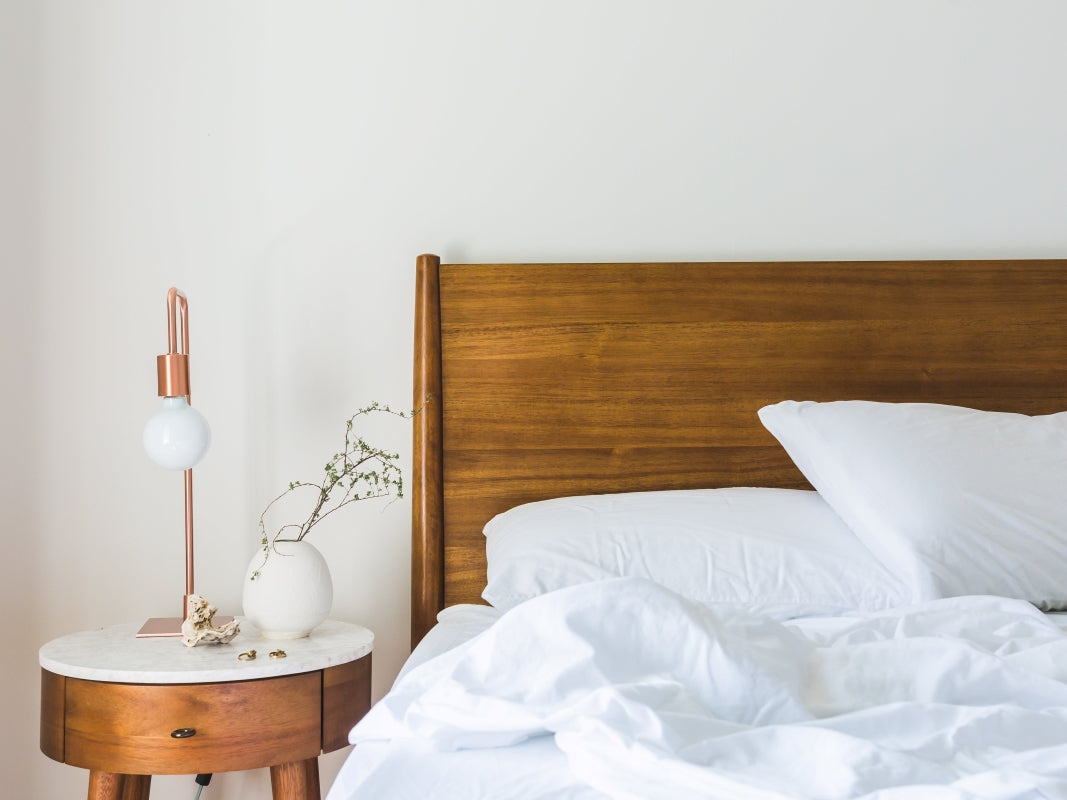 Why Sateen Weave? White bed with wooden headboard and side table